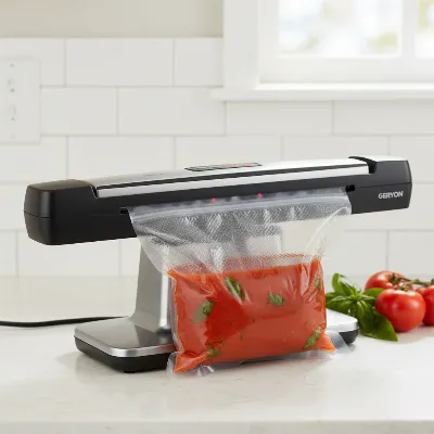 Geryon Vacuum Sealer effectively sealing a bag with liquid food in a home kitchen